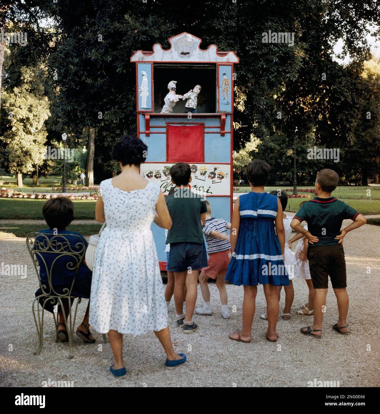 Pictured here are children gathered in front of puppet show at Villa ...