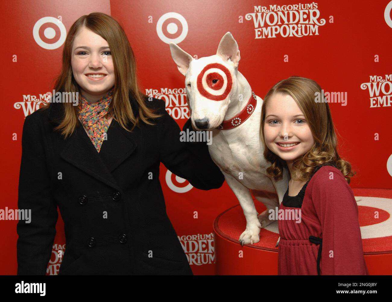 Danielle Hanratty, left, and Sammi Hanratty pose with Bullseye the