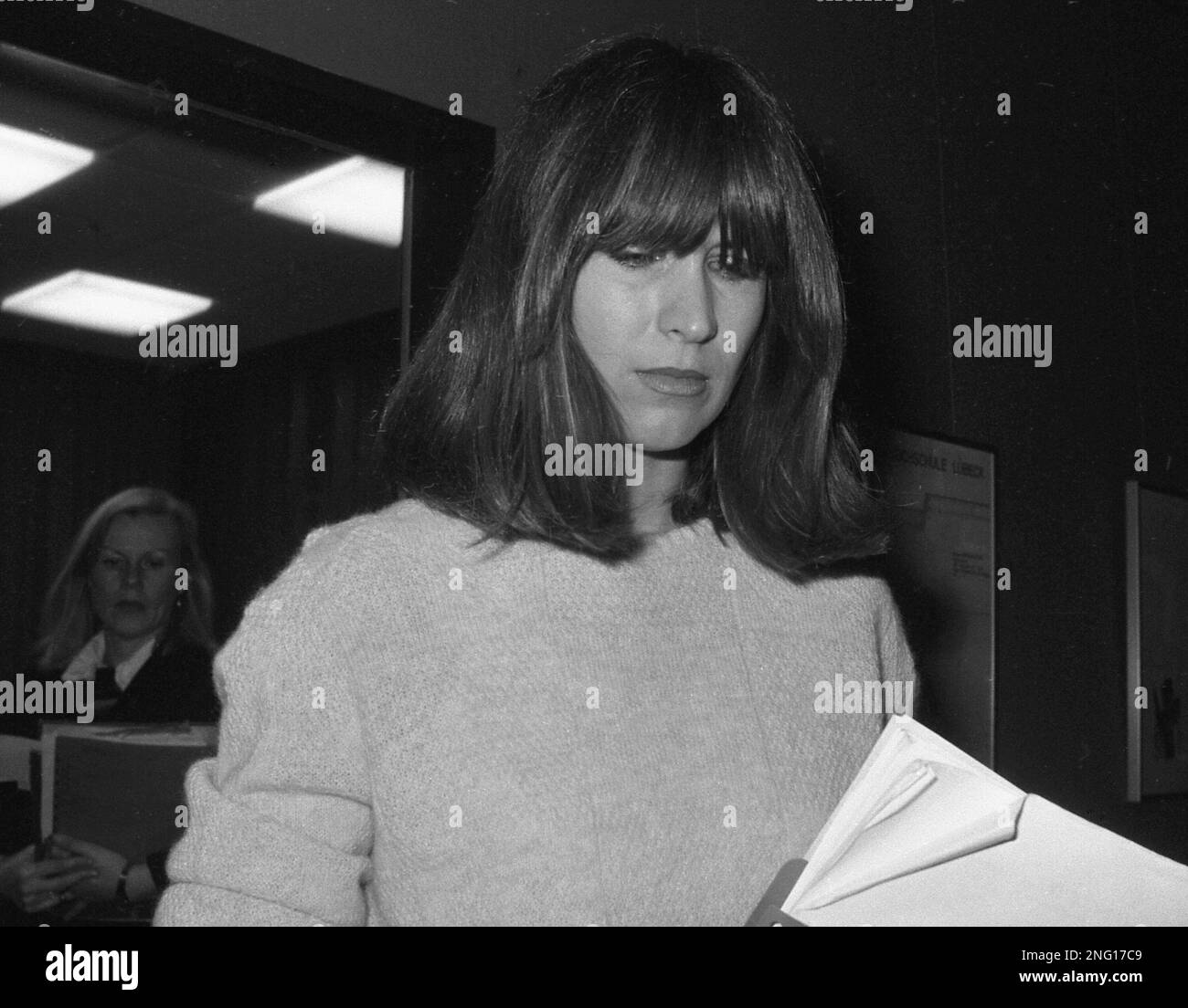 32yearold Marianne Bachmeier, holds some files as she leaves a