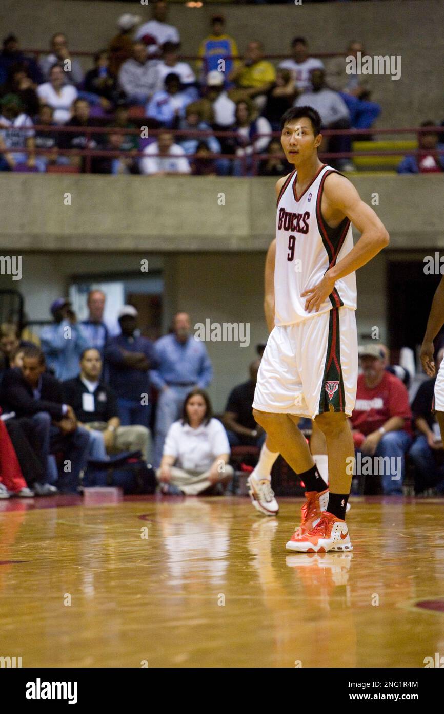 Milwaukee Bucks center Yi Jianlian of China walks off the court after ...