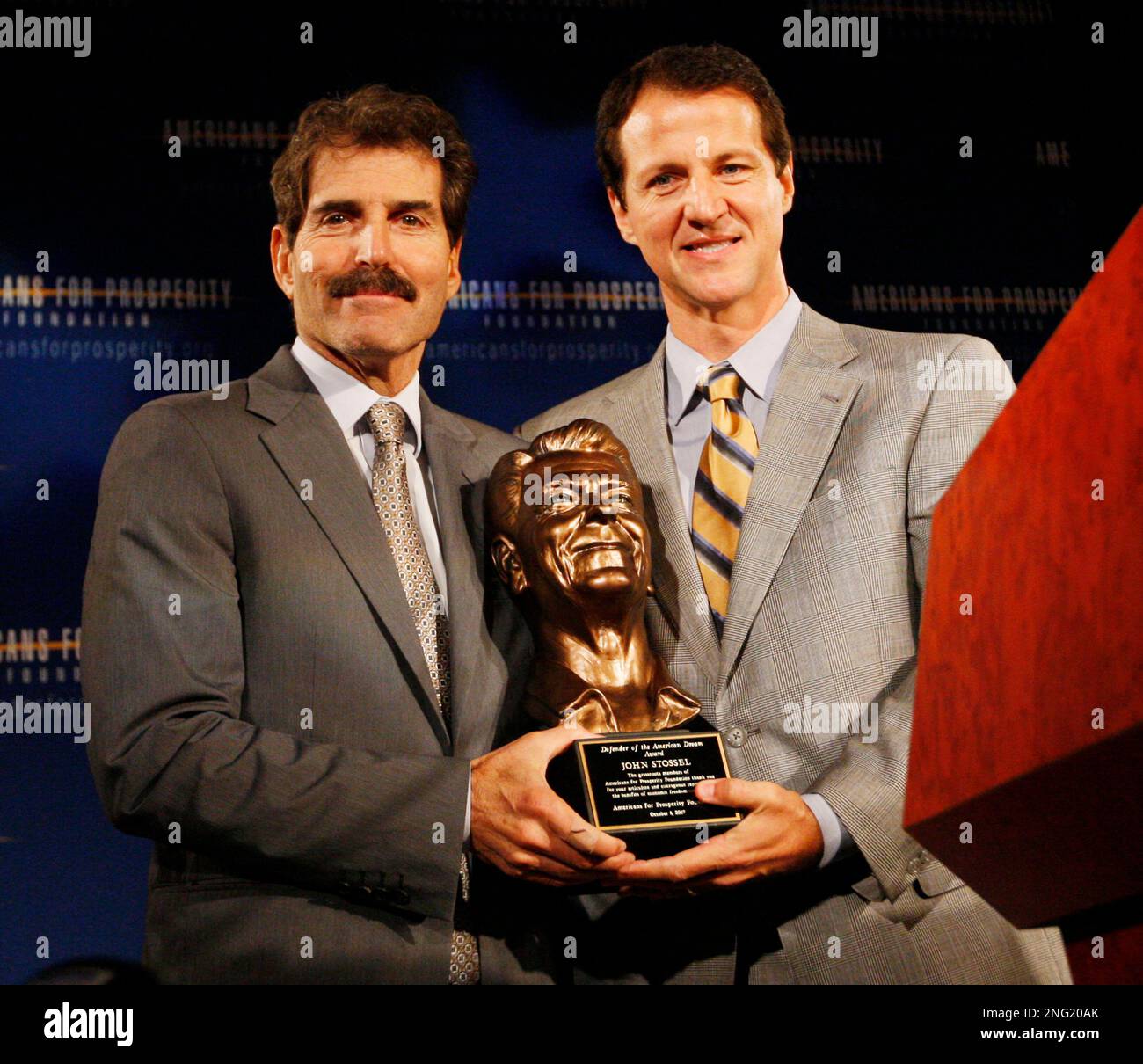 ABC News correspondent John Stossel, left, receives the Defenders of ...