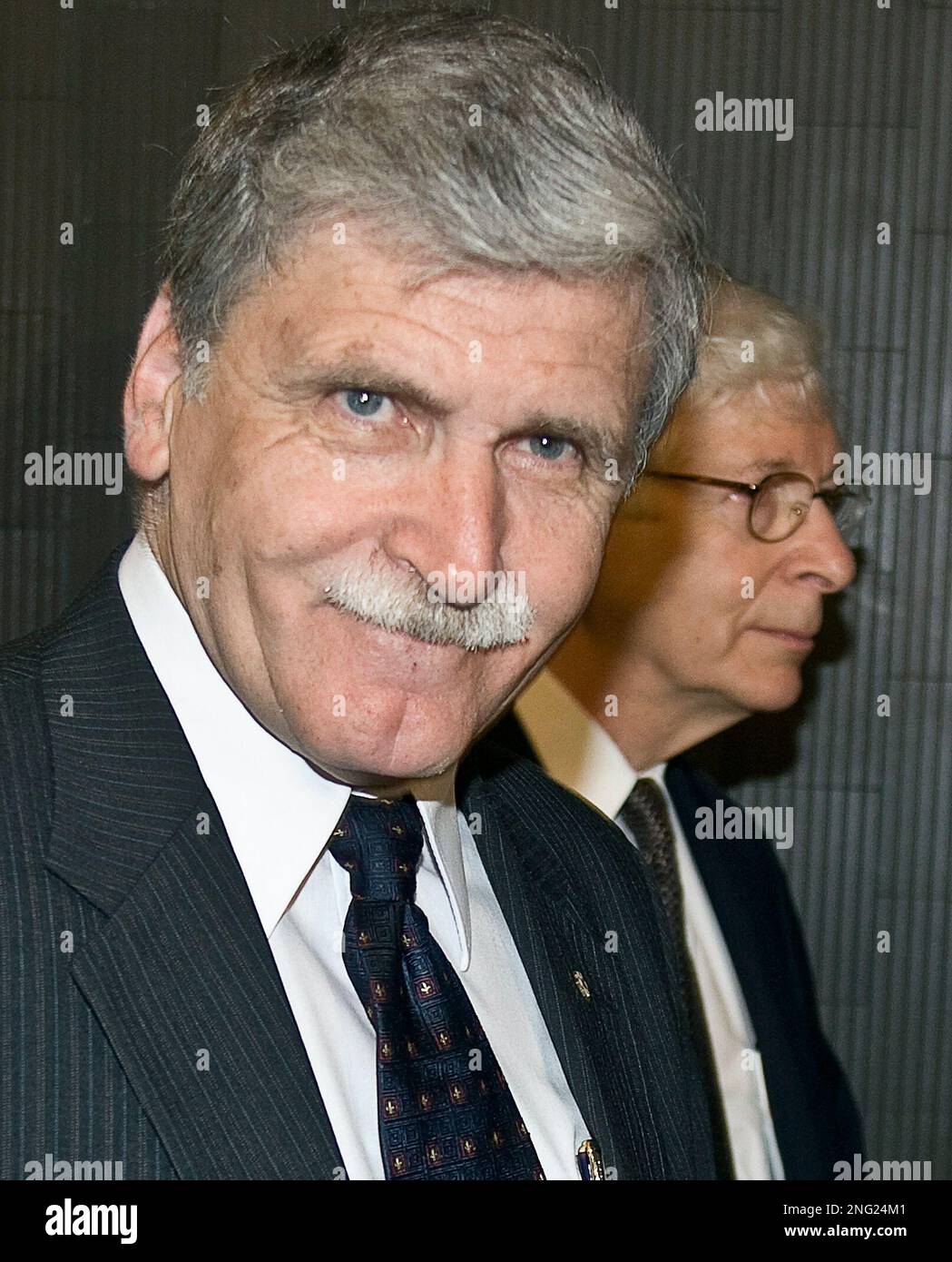 Retired general Romeo Dallaire, left, arrives at court with his 