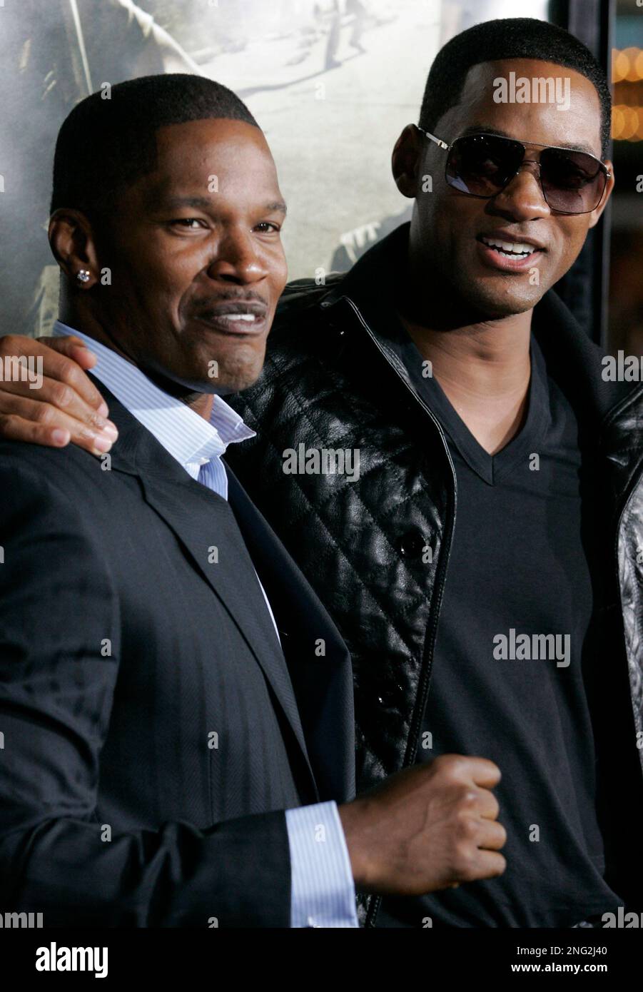 Actor Jamie Foxx, left, and actor Will Smith, right, pose on the press
