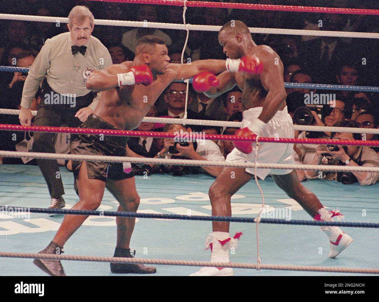 Heavyweight boxers Mike Tyson, left, and James "Buster" Douglas are seen during their bout, Feb