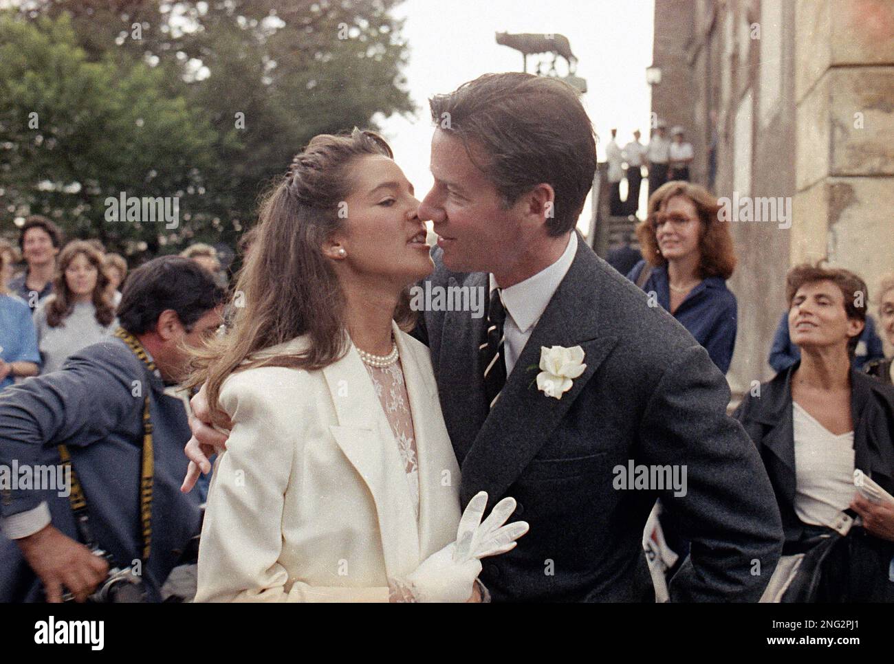 Fashion designer Calvin Klein kisses his new wife Kelly Rector after their  wedding at Rome's City Hall, Sept. 26, 1986. (AP Photo/Massimo Sambucetti  Stock Photo - Alamy