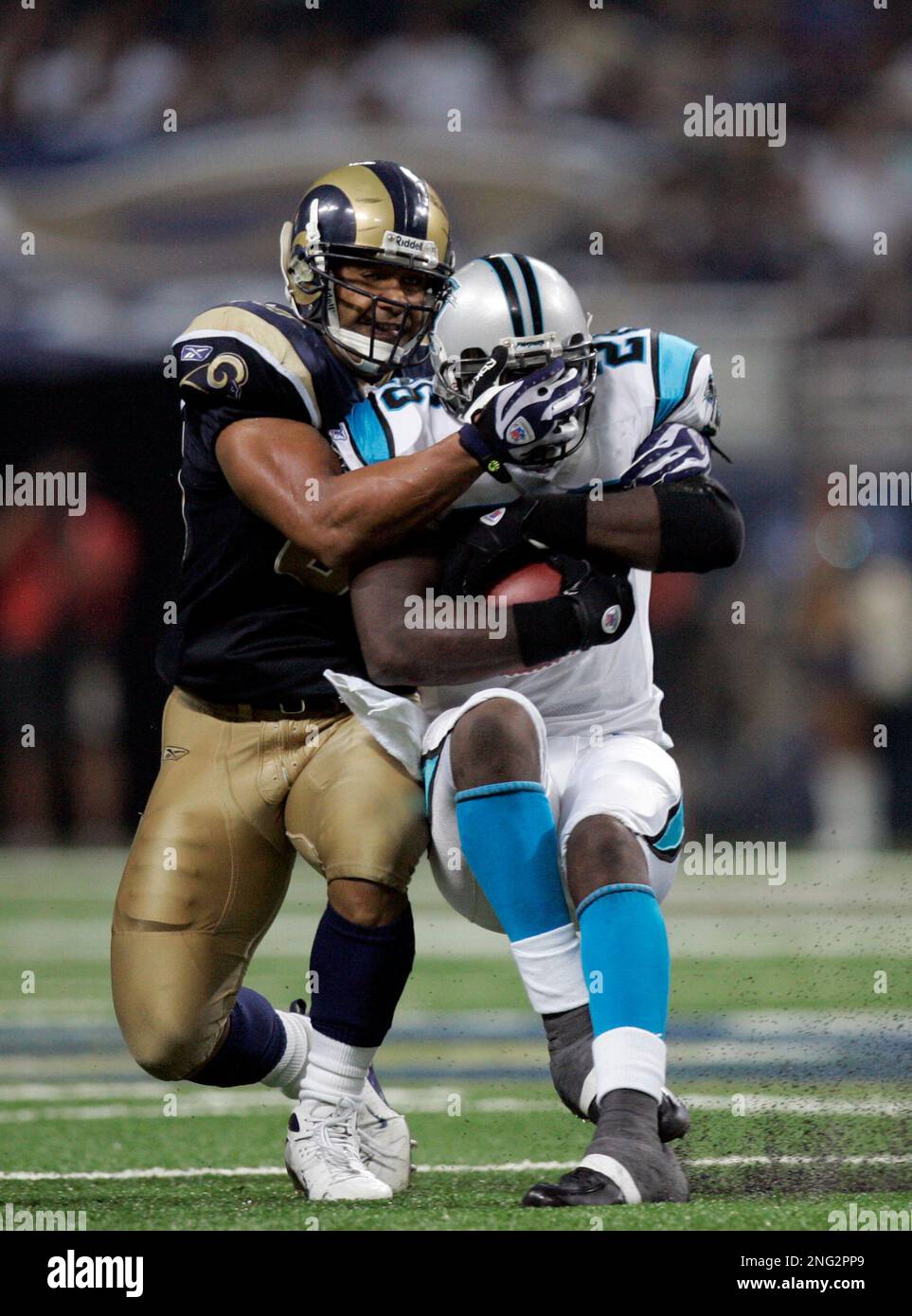 Carolina Panthers running back DeShaun Foster (26) breaks through the St.  Louis Rams defense for extra yardage during action Sunday, September 9,  2007 at Edward Jones Dome in St. Louis, Missouri. The