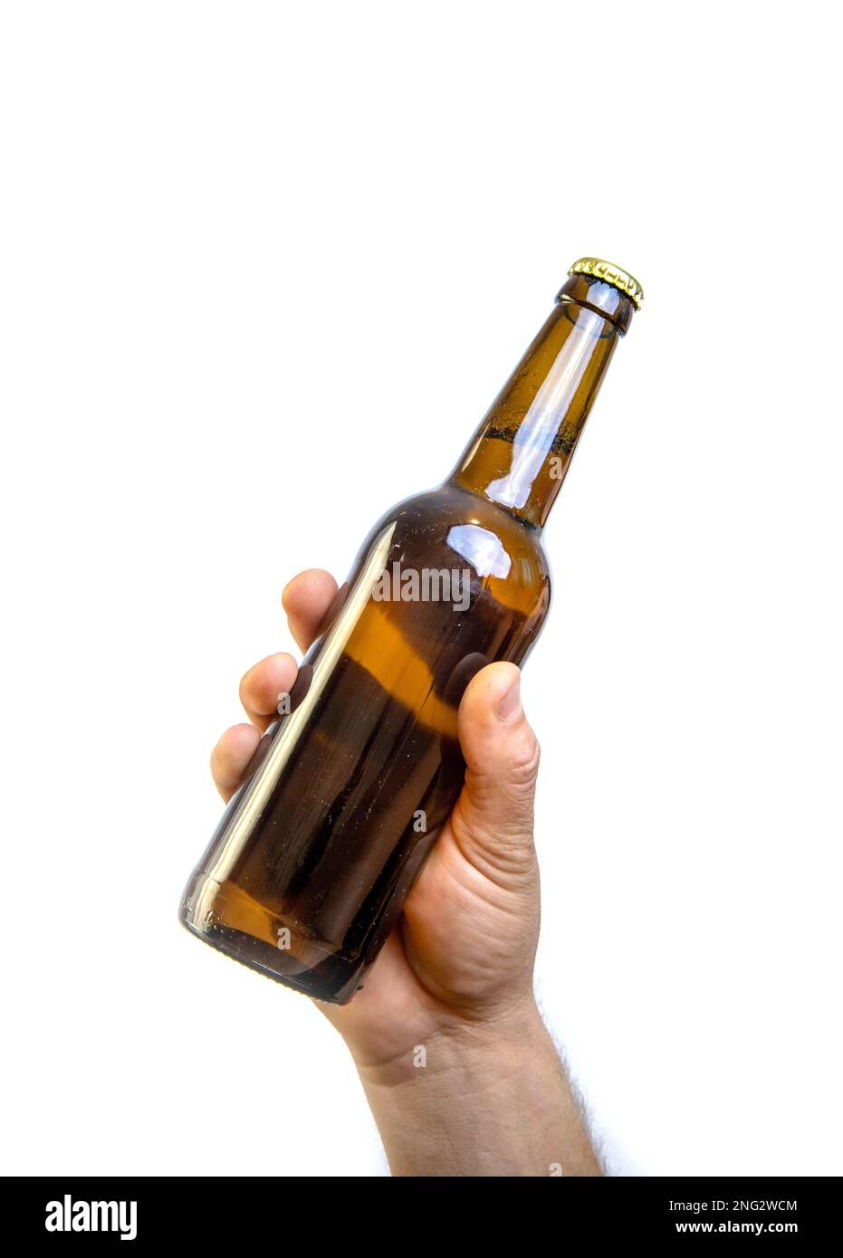 Beer bottle in hand isolated on white Stock Photo Alamy