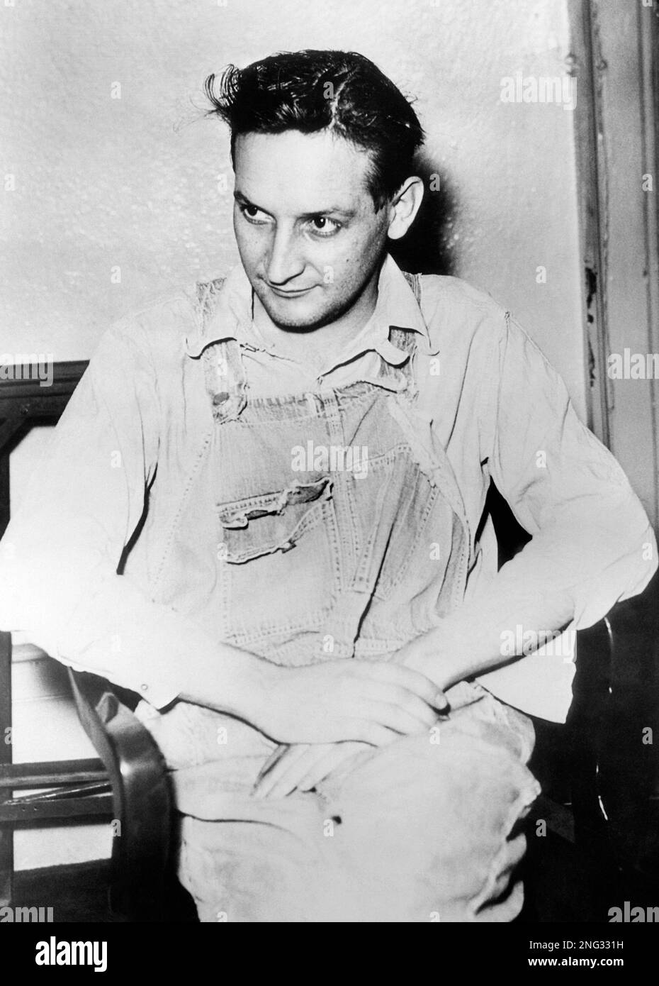 Clad in Overalls, Adam Richetti is shown here in the Jackson county Jail on  November 4, 1934 after he had been returned to Kansas City from Lisbon.. He  had been captured only