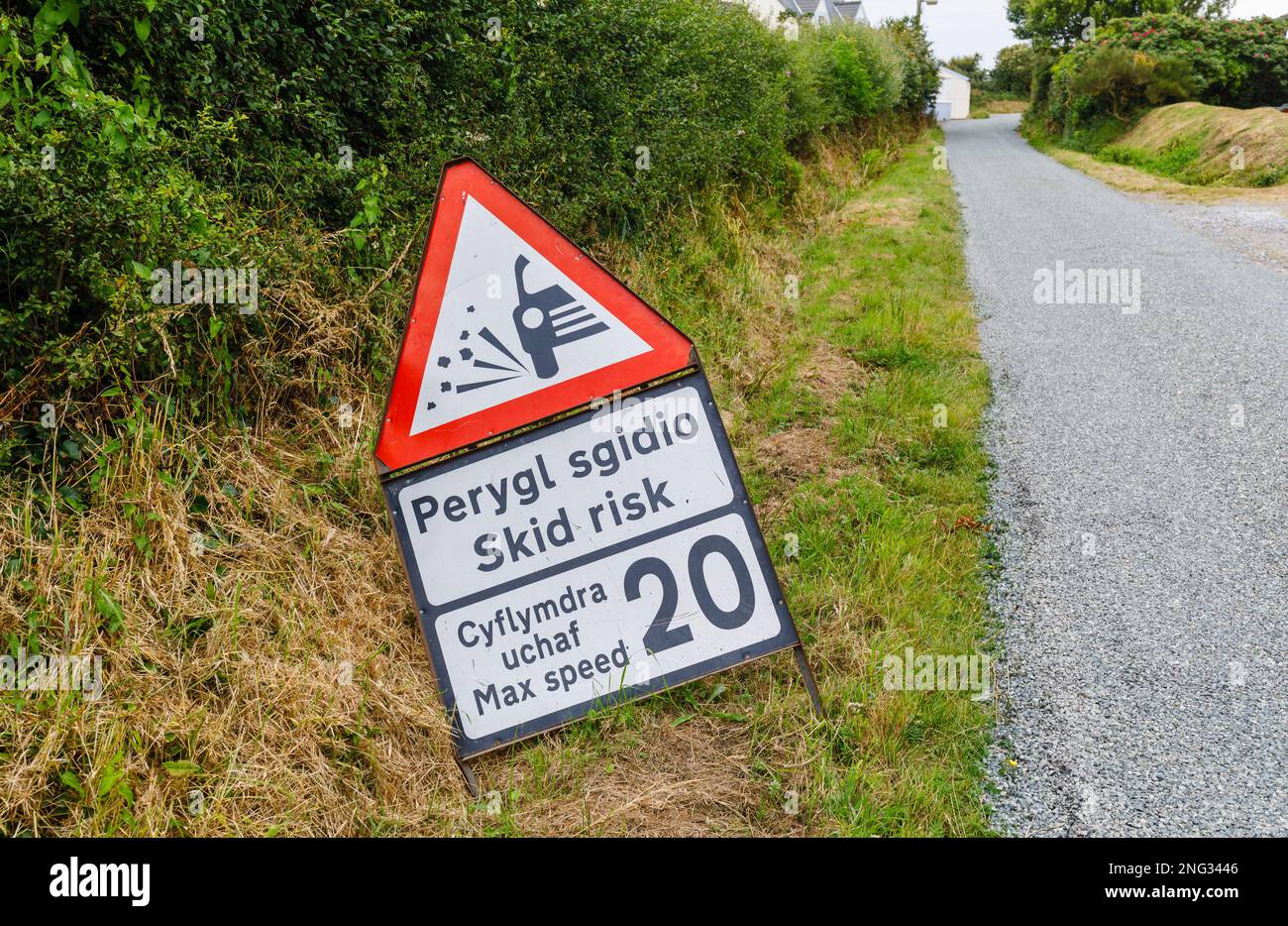 Loose chippings skid risk road sign in Marloes, a small village on the Marloes Peninsula in the Pembrokeshire Coast National Park, west Wales Stock Photo