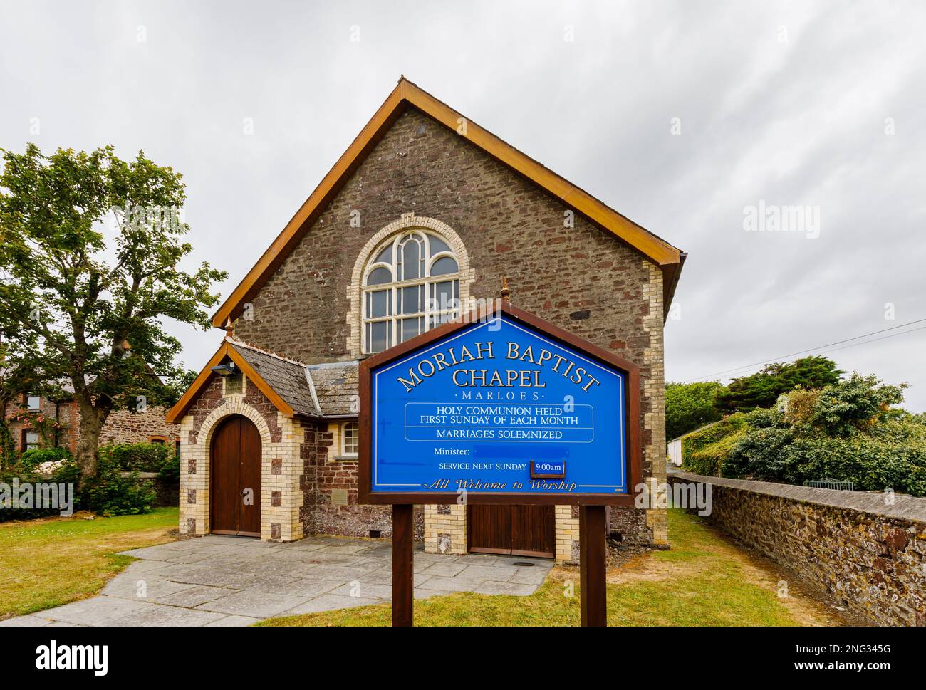 Blue name sign at Moriah Baptist Chapel in Marloes, a small village on the Marloes Peninsula in the Pembrokeshire Coast National Park, west Wales Stock Photo