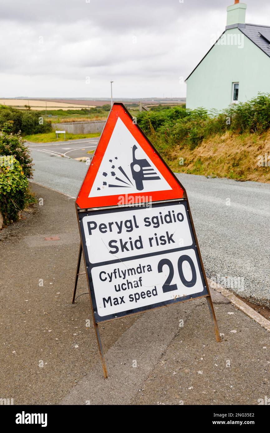 Loose chippings skid risk road sign in Marloes, a small village on the Marloes Peninsula in the Pembrokeshire Coast National Park, west Wales Stock Photo
