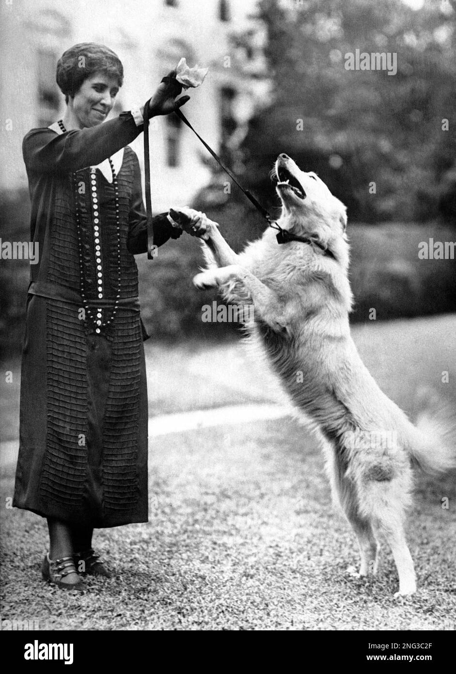 Mrs. Calvin Coolidge is shown in the South Grounds of the White House ...