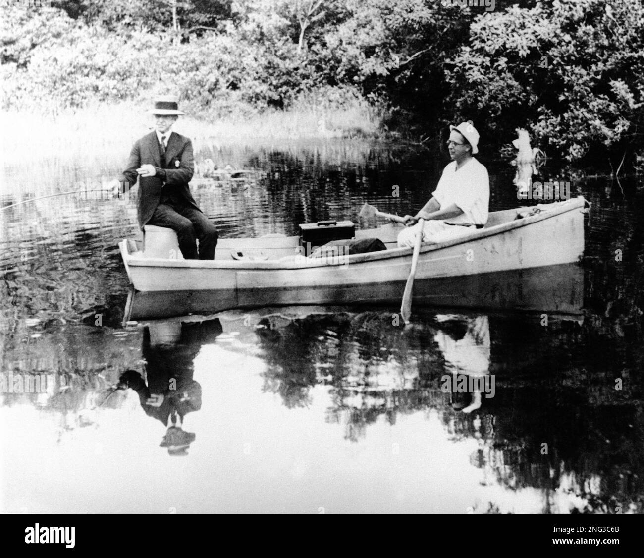 Stern Cod The former president angles off the stern of a rowboat on Mill Pond, in ...
