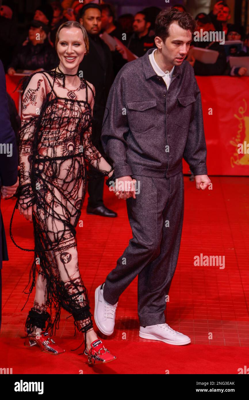 Rebecca-Jo Dunham, left, and Jay Baruchel pose for photographers at the