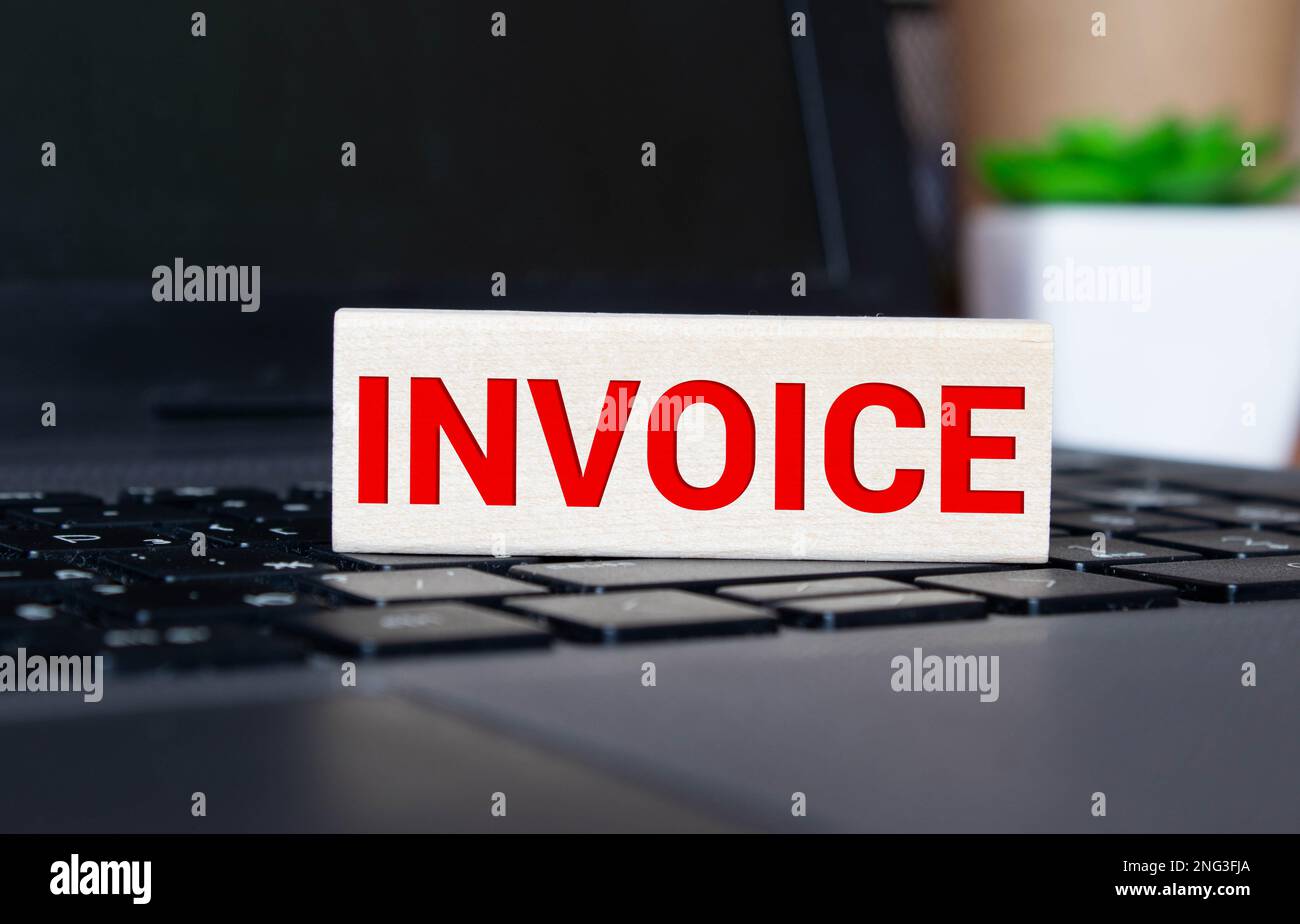INVOICE - word text and euro money on a wooden background, trolley basket for goods. Business concept, buying goods and products copy space. Stock Photo