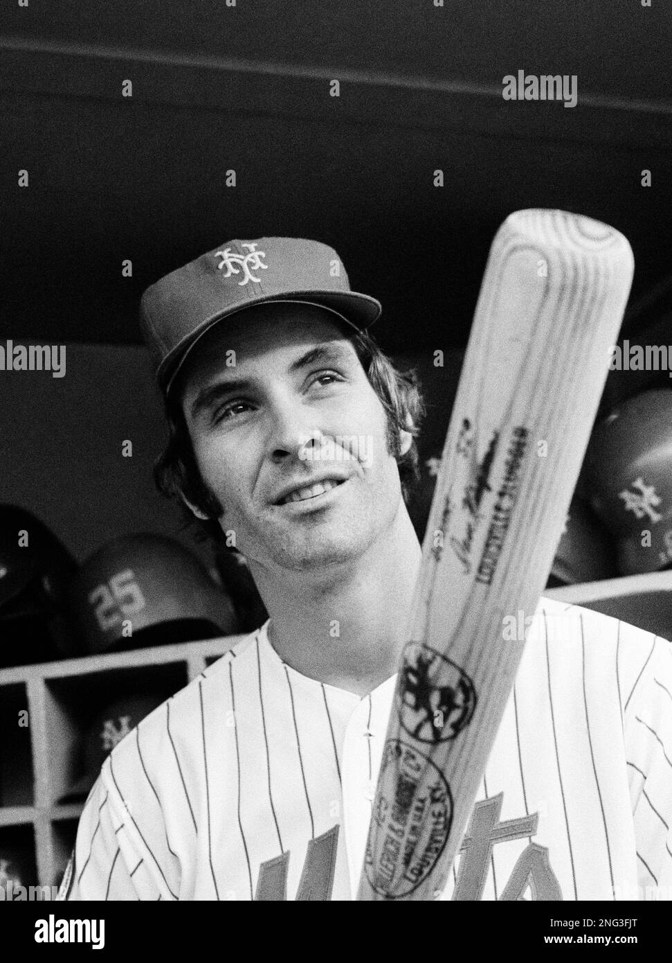 New York Mets Dave Kingman, home run specialist, relaxes running a boat  after an exhibition game in Indian Rocks, Fla., March 15, 1977. Aaron, son  of Philadelphia Phillies Bob Boone, rides in
