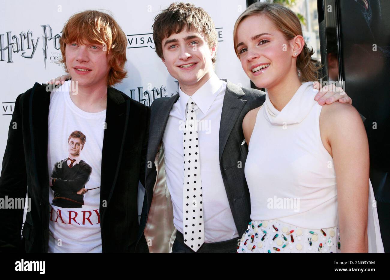 Rupert Grint, left, Daniel Radcliffe, center, and Emma Watson pose
