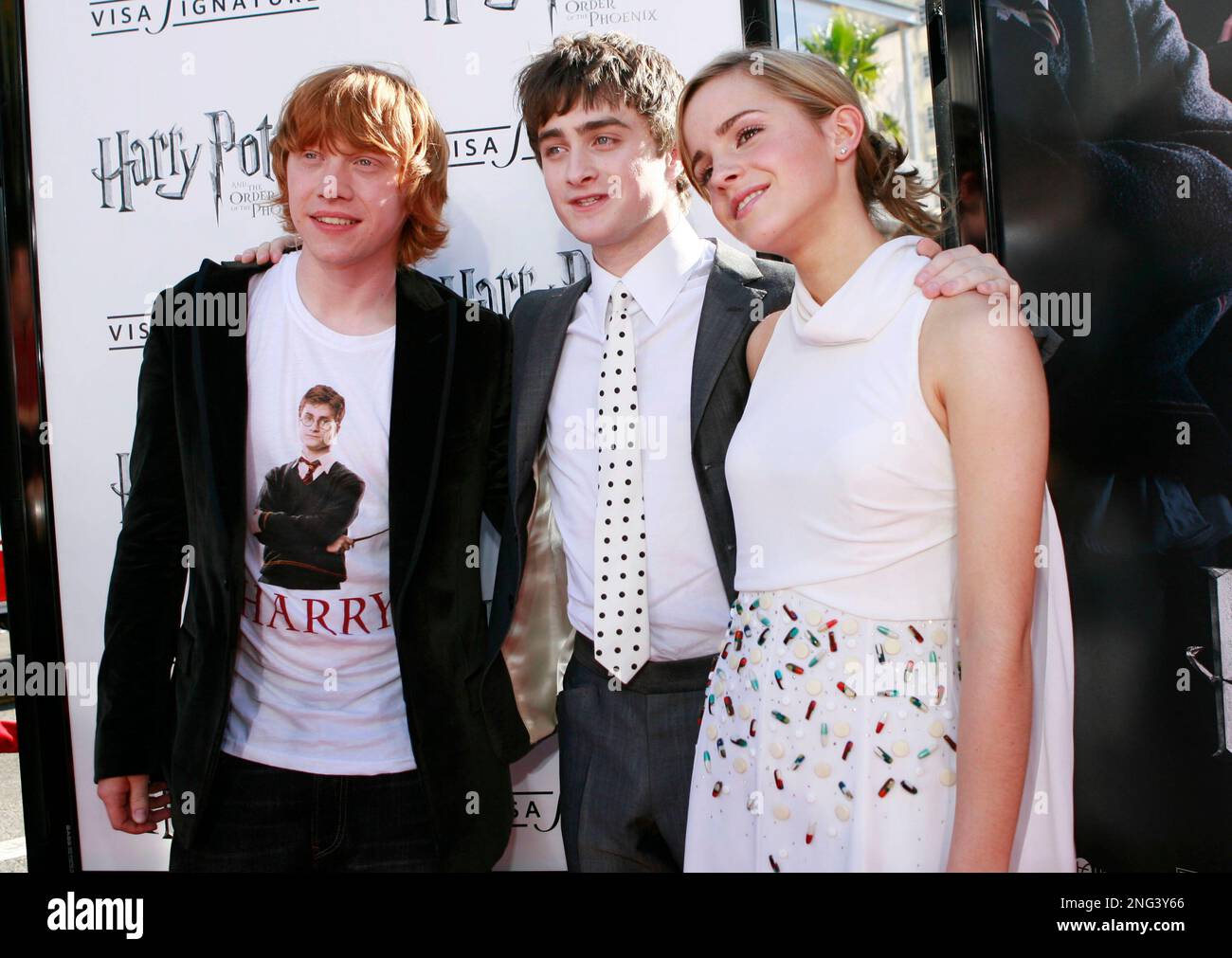 Rupert Grint, left, Daniel Radcliffe, center, and Emma Watson pose