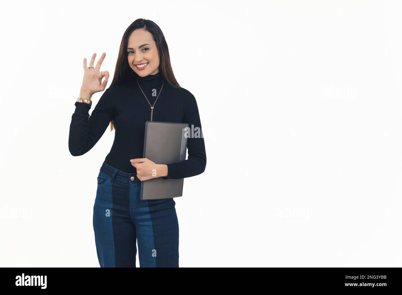 A confident young woman holding a black file and making an approval ...