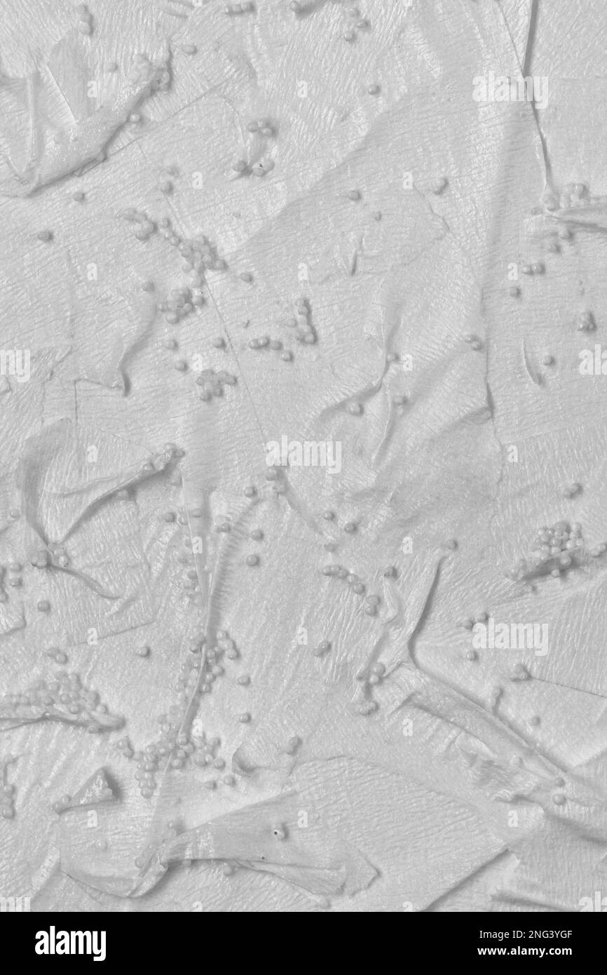 Textured handmade paper with pieces of adhesive tape and beads