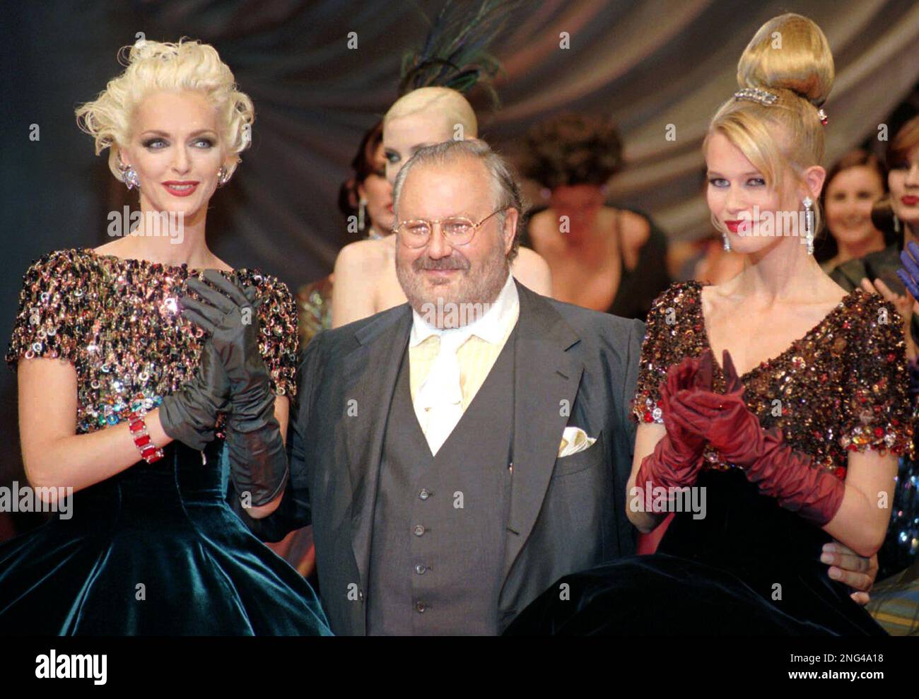 FILE ** Italian fashion designer Gianfranco Ferre, center, is 