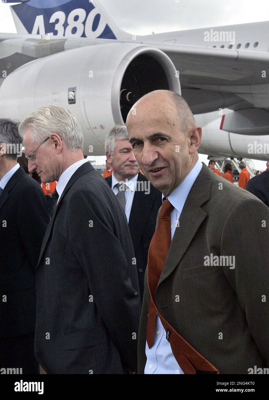 EADS cochief executive Louis Gallois, right, walks alongside an Airbus