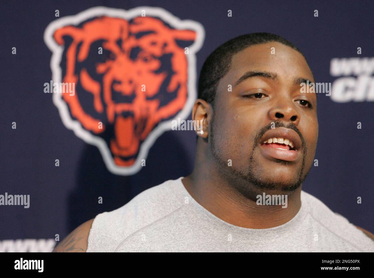 Chicago Bears defensive lineman Tank Johnson speaks at a news