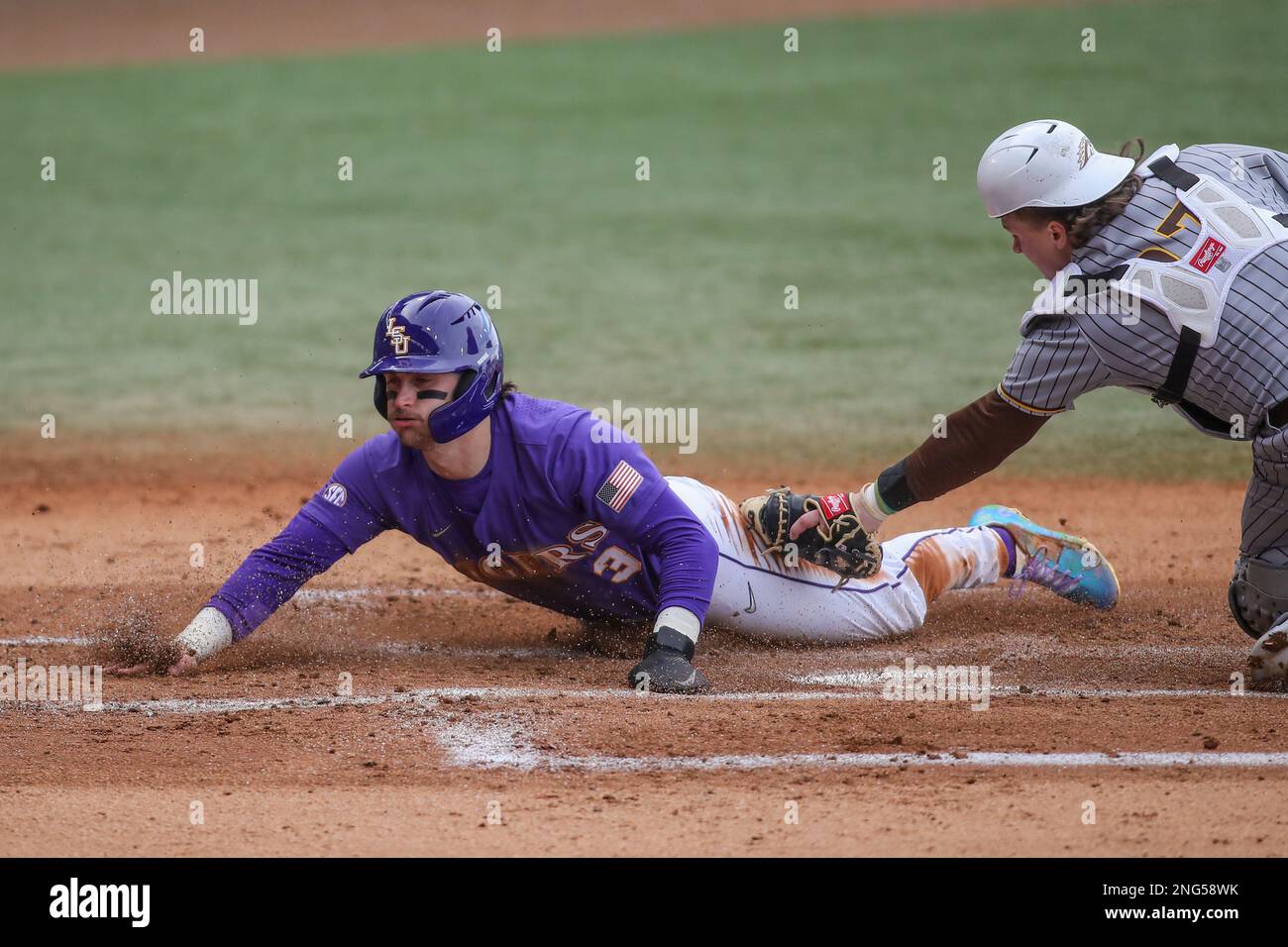 Baton Rouge, LA, USA. 17th Feb, 2023. LSU's Dylan Crews (3) slides into ...