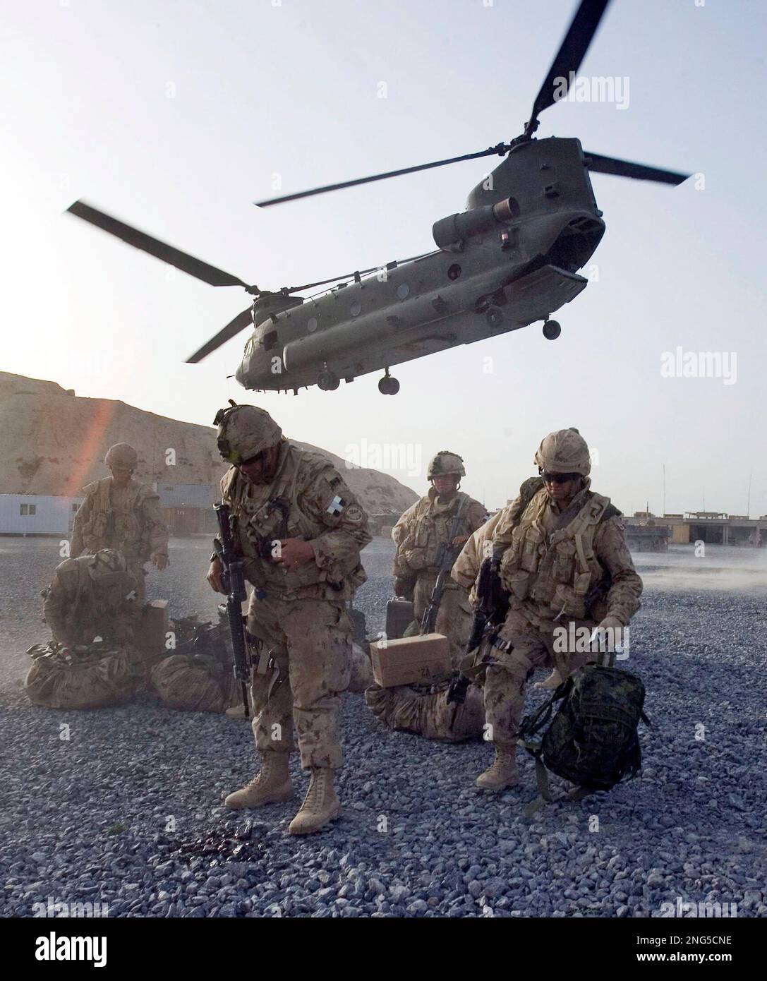 Soldiers with the 2nd Royal Canadian Horse Artillery protect themselves ...