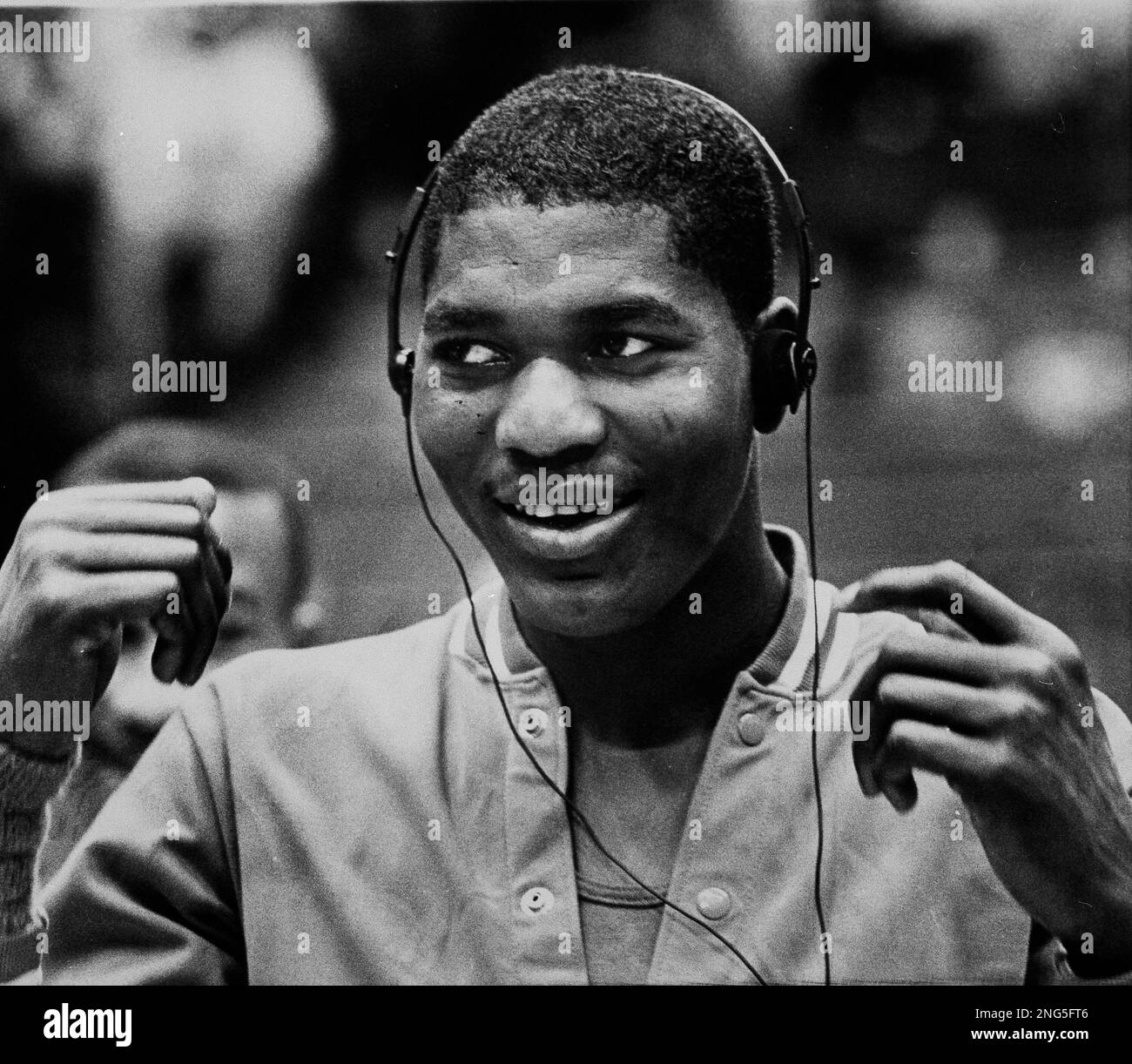 University of Houston's Akeem Abdul Olajuwon listens to a portable tape
