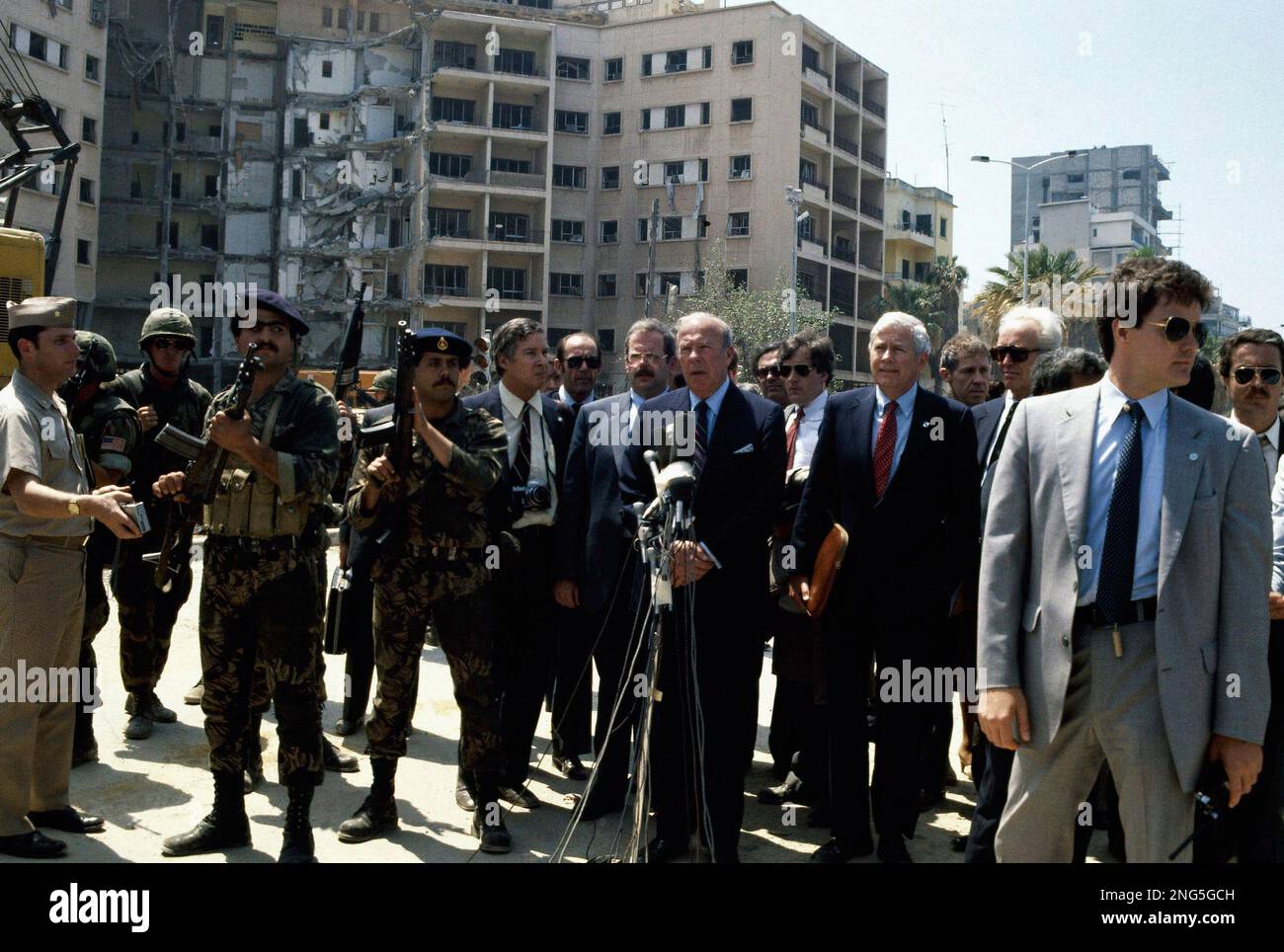 United States Secretary of State George Shultz is shown in front of the ...