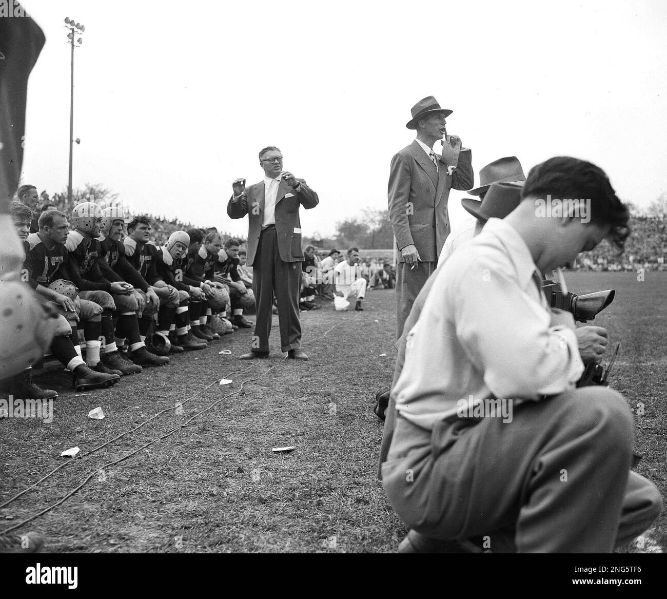 Coach Curly Lambeau, top, center, appears tense during a play in the second  half of the Green Bay Packers-Chicago Cardinals game at Green Bay, Wisc.,  Oct. 12, 1947. Don Hutson, coach, is