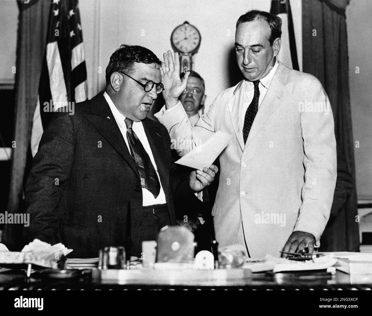 Robert Moses, right, is sworn in as commissioner of the Triborough 