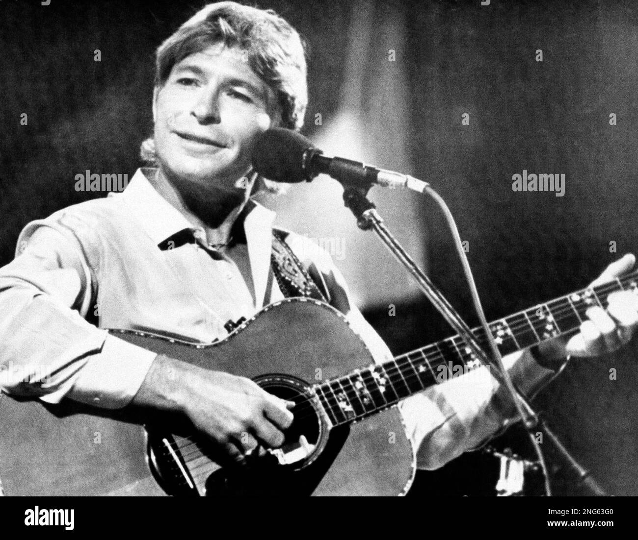 American singer John Denver appears during his concert at the Festival de la Cancion music