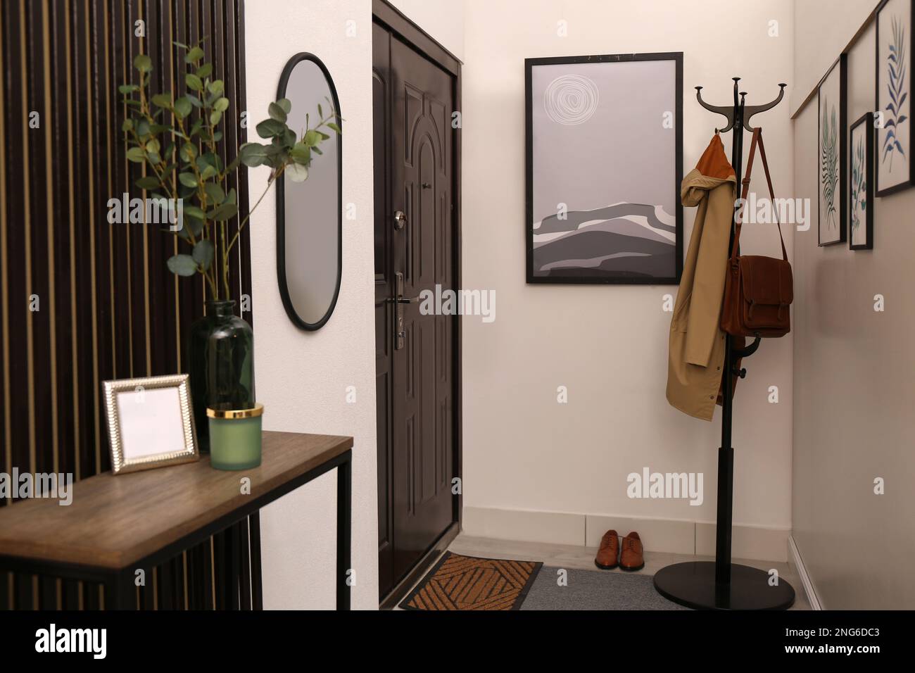 Modern hallway interior with stylish furniture and paintings Stock Photo