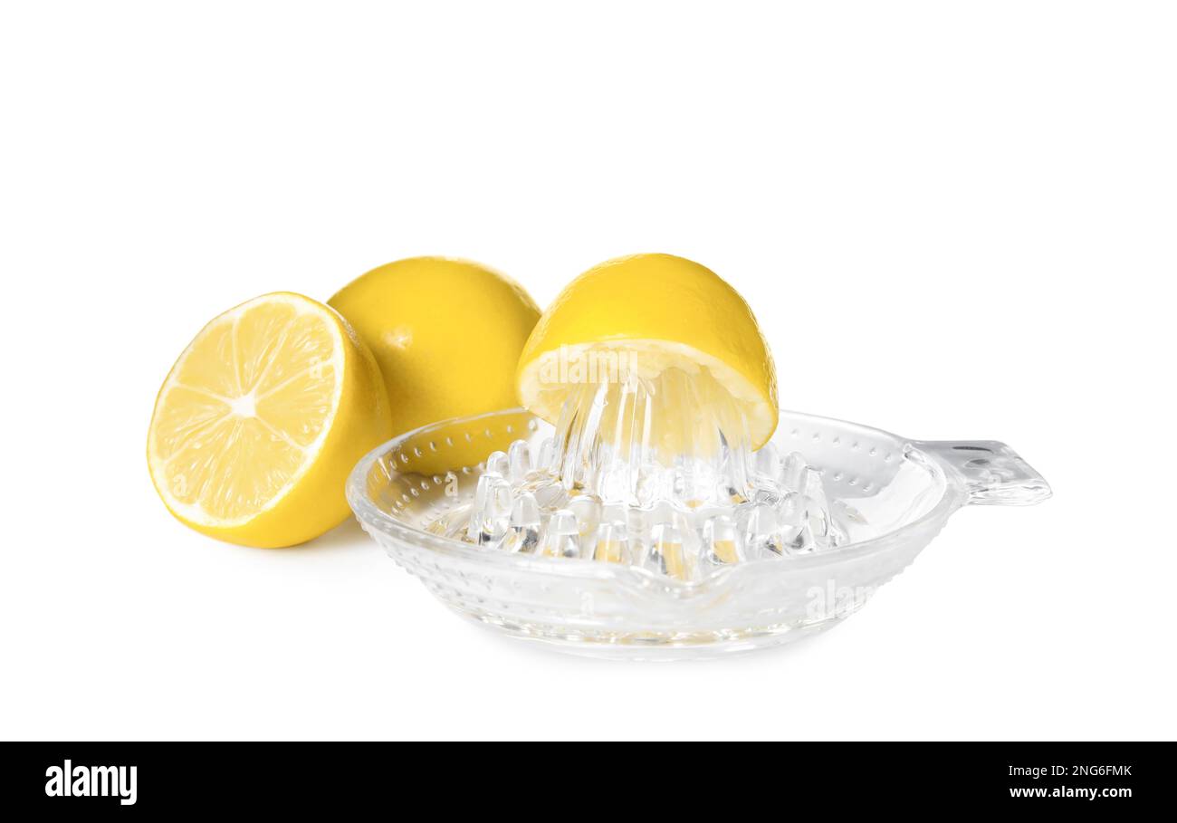 Plastic juicer and ripe lemons on white background Stock Photo