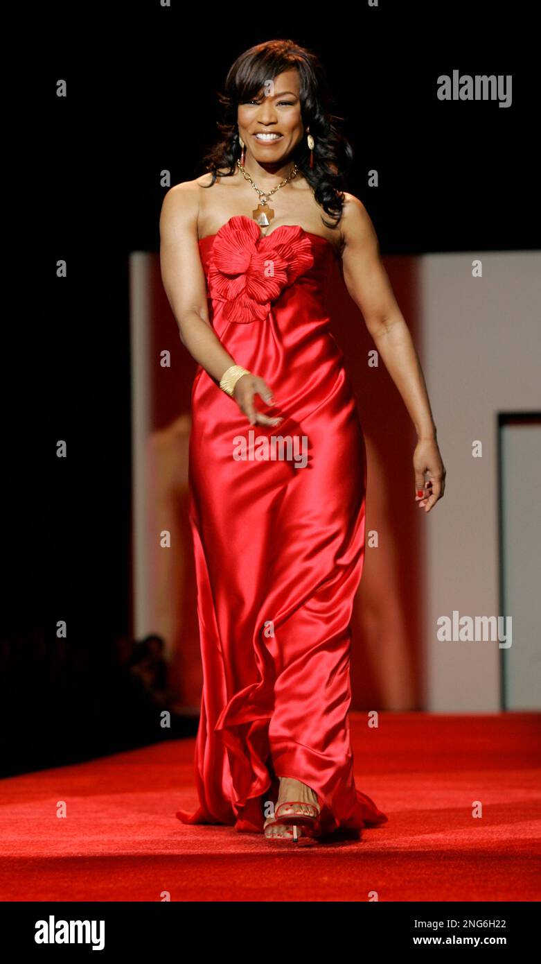 Actress Angela Bassett, wearing a dress by designer Carmen Marc Valvo,  walks the runway during the Red Dress Heart Truth show, during fashion week  in New York, Friday Feb. 2, 2007. The