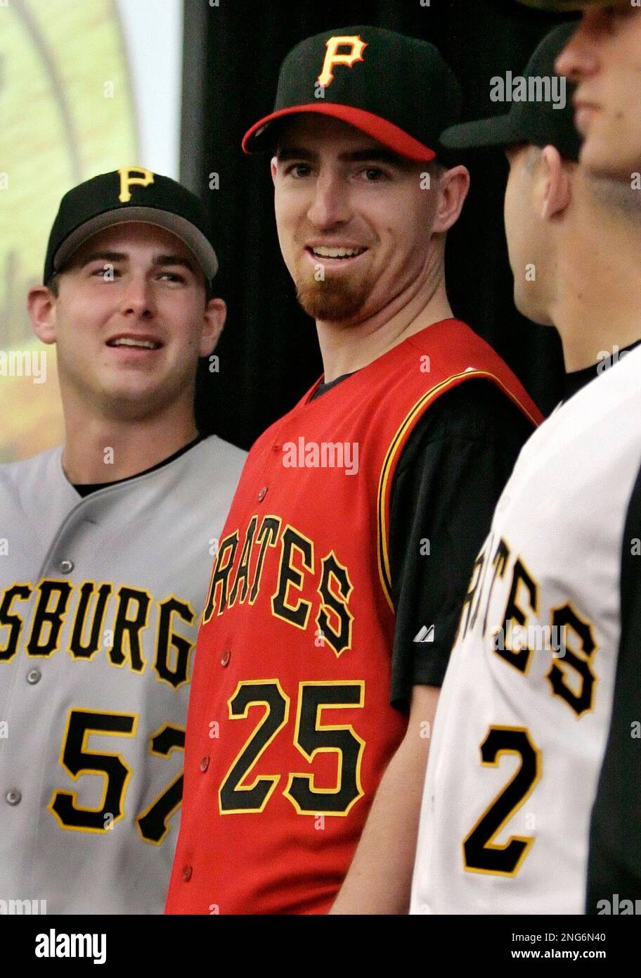 Pittsburgh Pirates first baseman Adam LaRoche (25) models a new alternate  jersey, as he stands between pitcher Zach Duke (57) and Jack Wilson (2)  during the opening day of Pirate Fest in