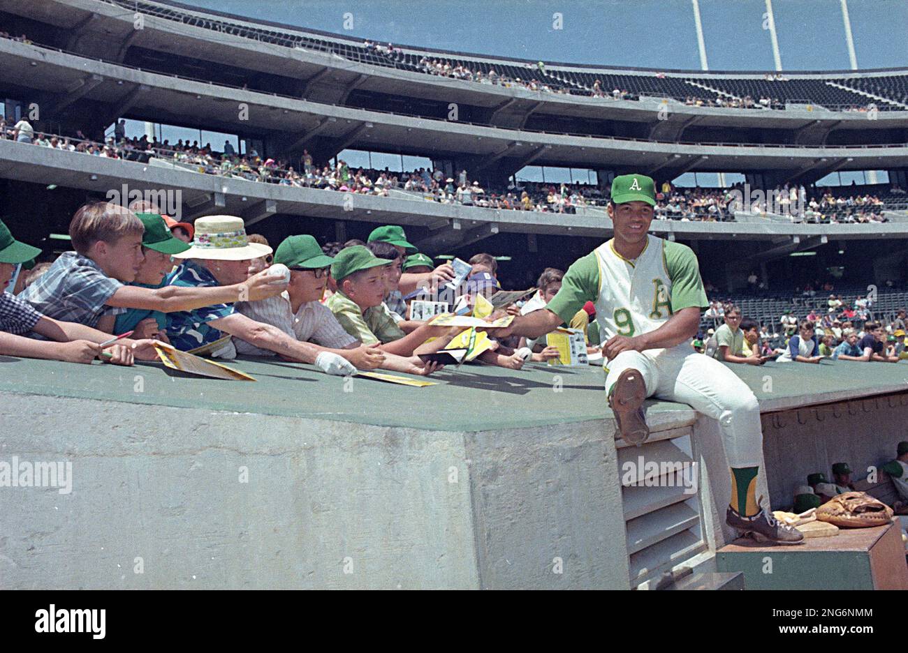Oakland Athletics' player Reggie Jackson is shown with fans in