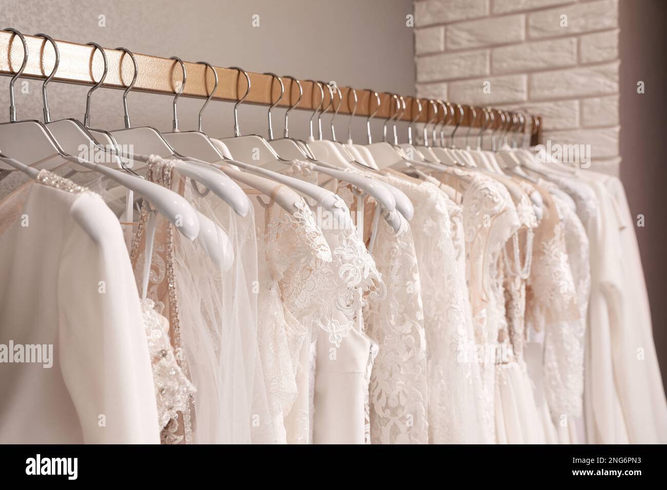Dresses on hangers hi-res stock photography and images - Alamy
