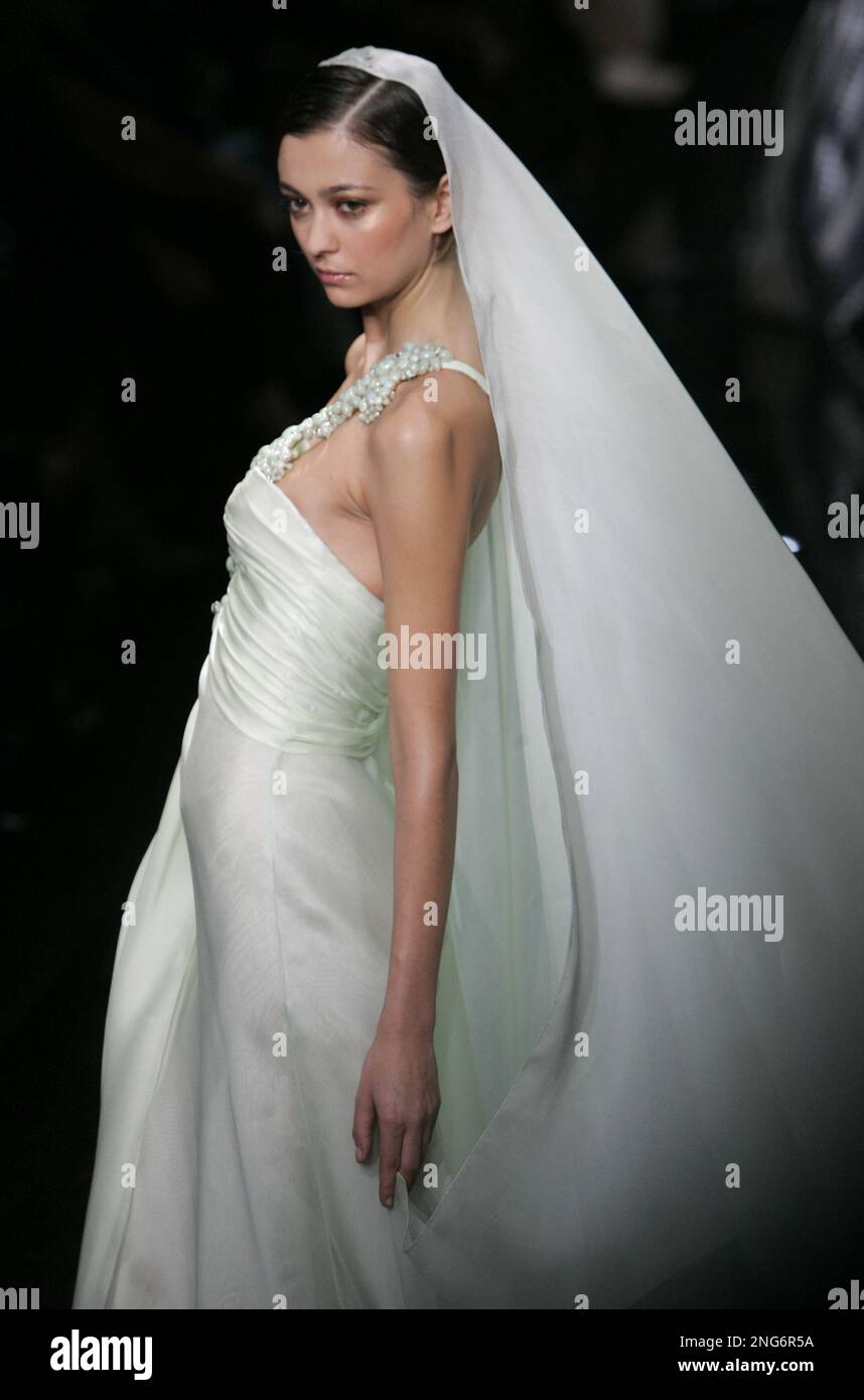 A model wears a creation by Italian born fashion designer Giorgio Armani for his spring summer 2007 Haute Couture fashion collection presented Wednesday Jan. 24 2007 in Paris. AP Photo Christophe Ena ...