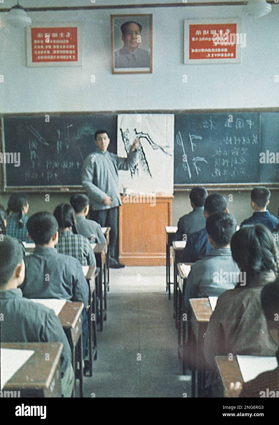 A teacher at a secondary school in China gives students a lesson in ...