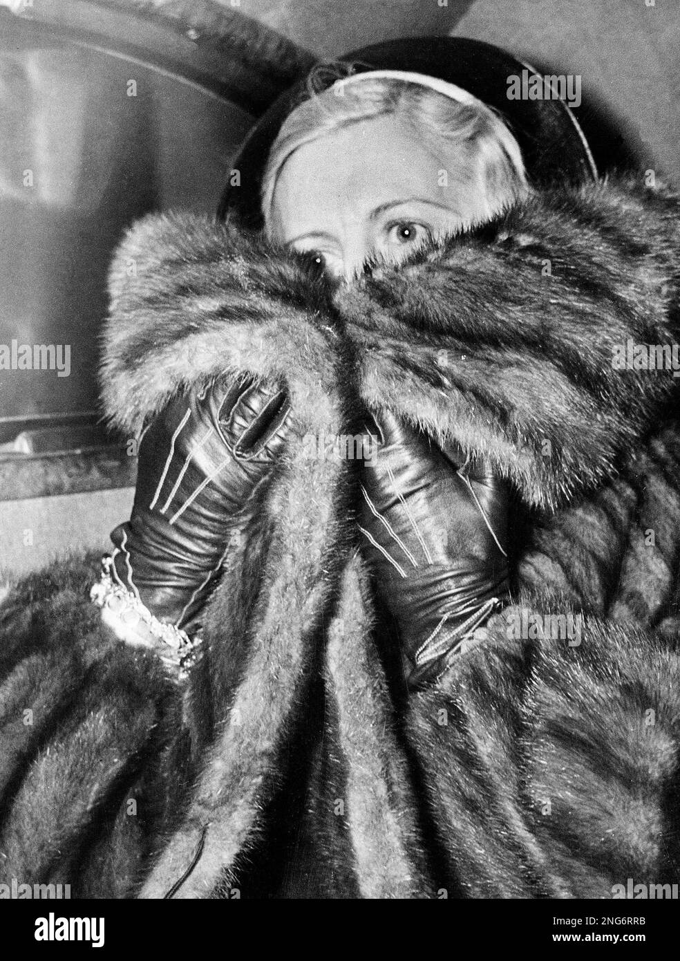 Mae Capone, wife of gangster Al Capone, is seen on her way to visit