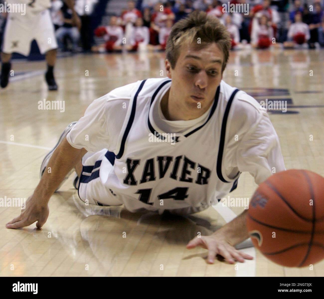 Xavier guard Johnny Wolf dives for a loose ball during a 