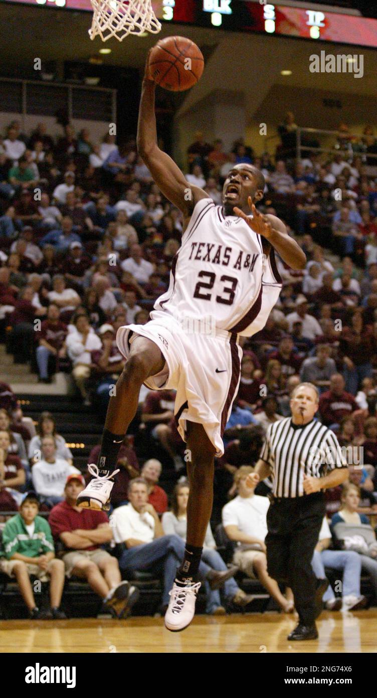 Texas A&M's Josh Carter takes a shot with the basketball against