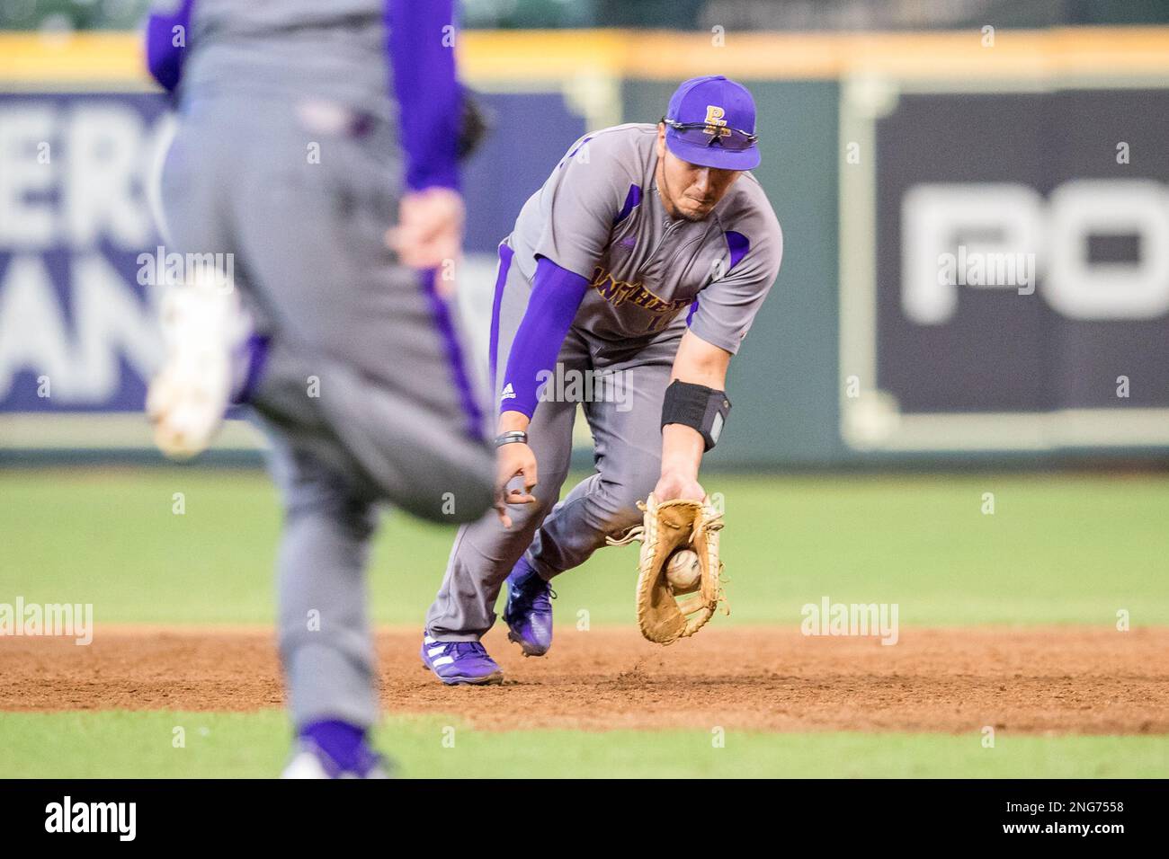 Houston, Texas, USA. 17th Feb, 2023. Prairie View infielder Alex Martinez (12) fields a ground ball during the NCAA baseball game between the Prairie View A&M Panthers and the Grambling State Tigers in the 2023 Cactus Jack HBCU Classic at Minute Maid Park in Houston, Texas. Prairie View defeated Grambling 7-5. Prentice C. James/CSM/Alamy Live News Stock Photo