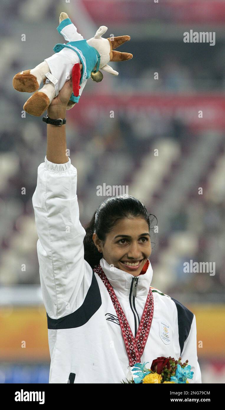 India's Anju Bobby George waves after receiving the silver medal for ...