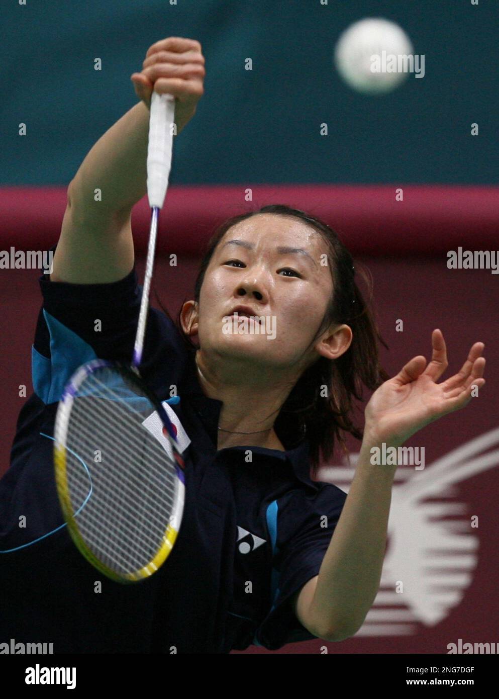 Japan's Kaori Mori hits the shuttlecock against Li Li of Singapore during  the Asian Games badminton women's team semifinals in Doha, Qatar, Monday  Dec. 4, 2006. (AP Photo/Kin Cheung Stock Photo - Alamy