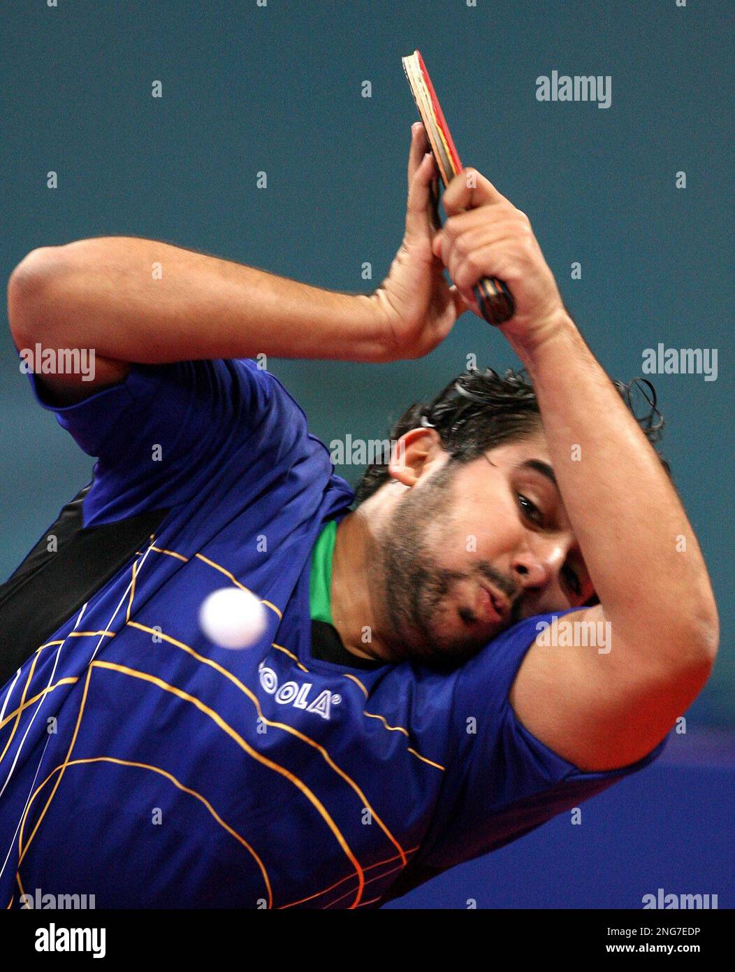 Bahrain's Hamad Bu Hijji returns a shot from Philippines' Ernesto Ebuen