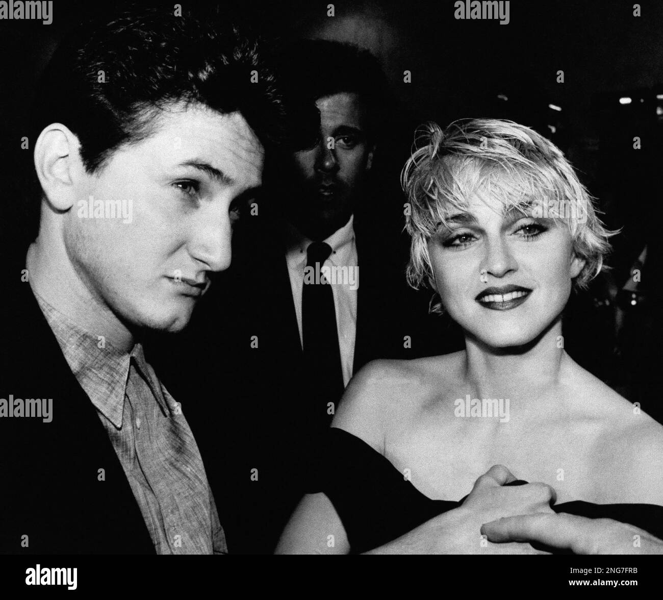 Actor Sean Penn and his wife, singer Madonna, stop to chat with